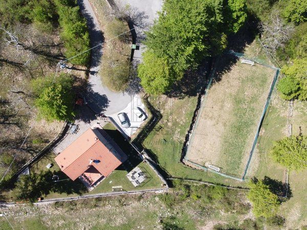 Aerial view of the house, grounds and five-a-side football pitch