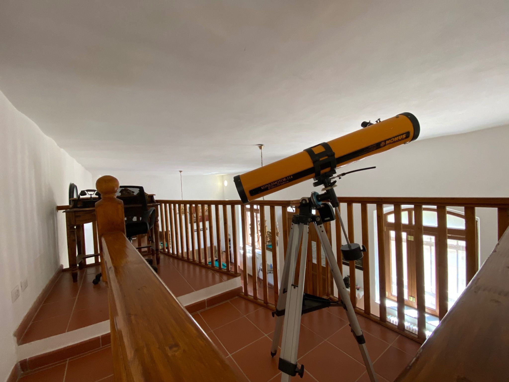 Wooden internal mezzanine with telescope