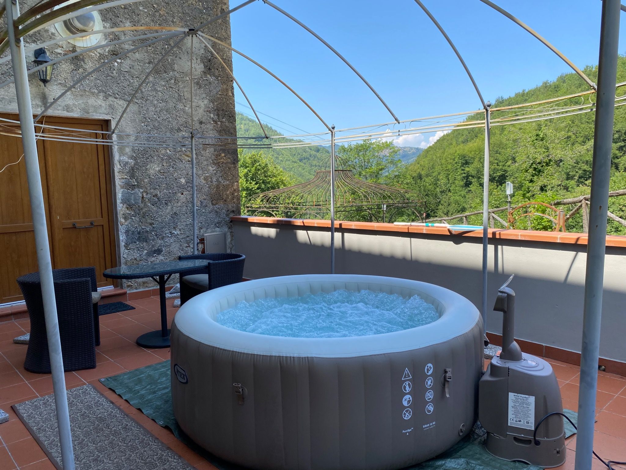 Outdoor Jacuzzi on the terrace with mountain views